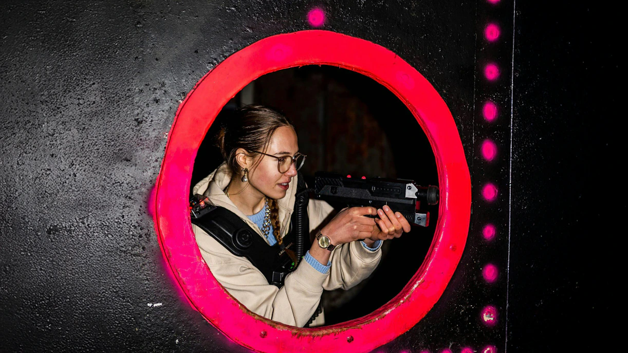 Person playing laser tag in Rotterdam arena.