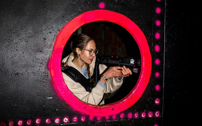 Person playing laser tag in Rotterdam arena.