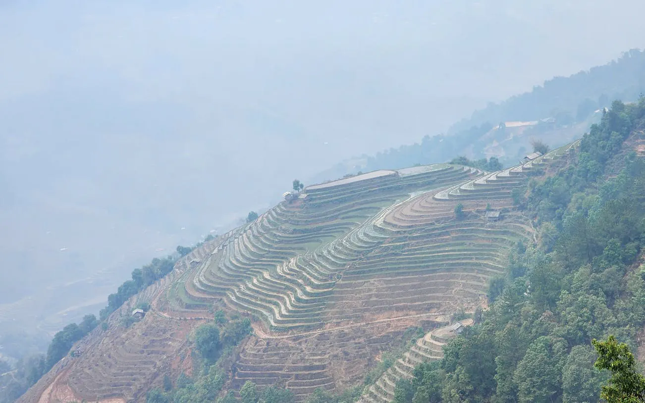 Mu Cang Chai rice terraces with misty hills, Vietnam.