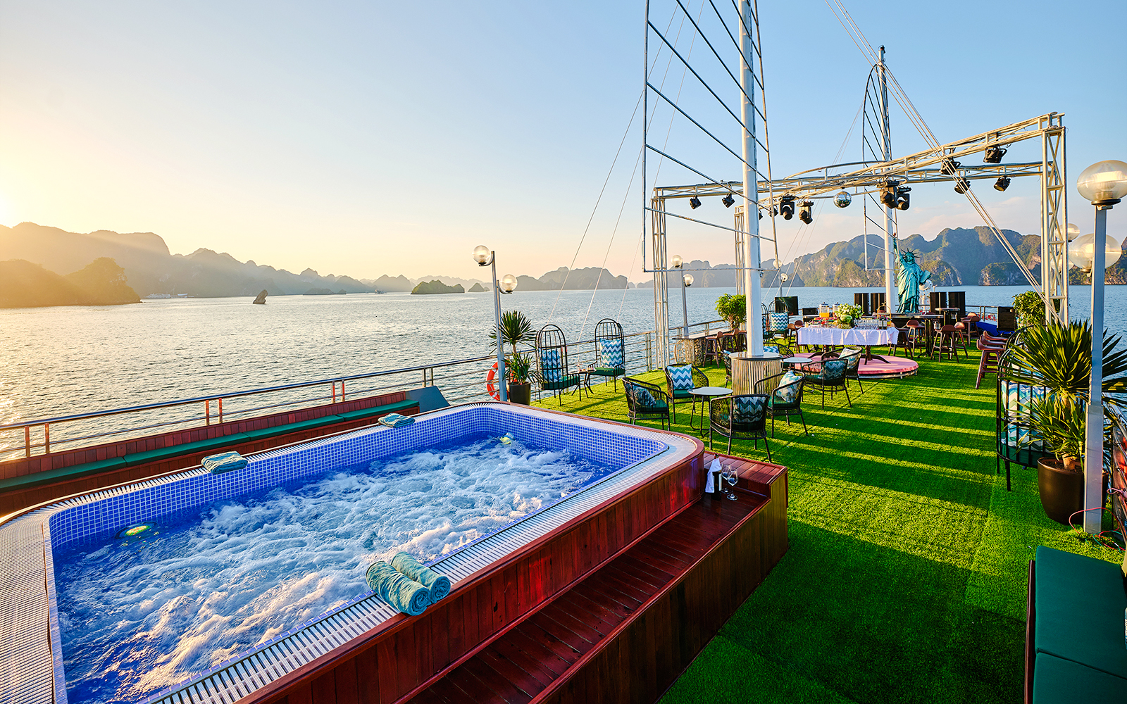Jacuzzi on cruise ship deck at sunset in Ha Long Bay, Vietnam.