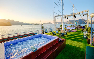 Jacuzzi on cruise ship deck at sunset in Ha Long Bay, Vietnam.