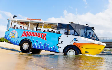 Aquaduck vehicle transitioning from land to water on a Gold Coast city tour.
