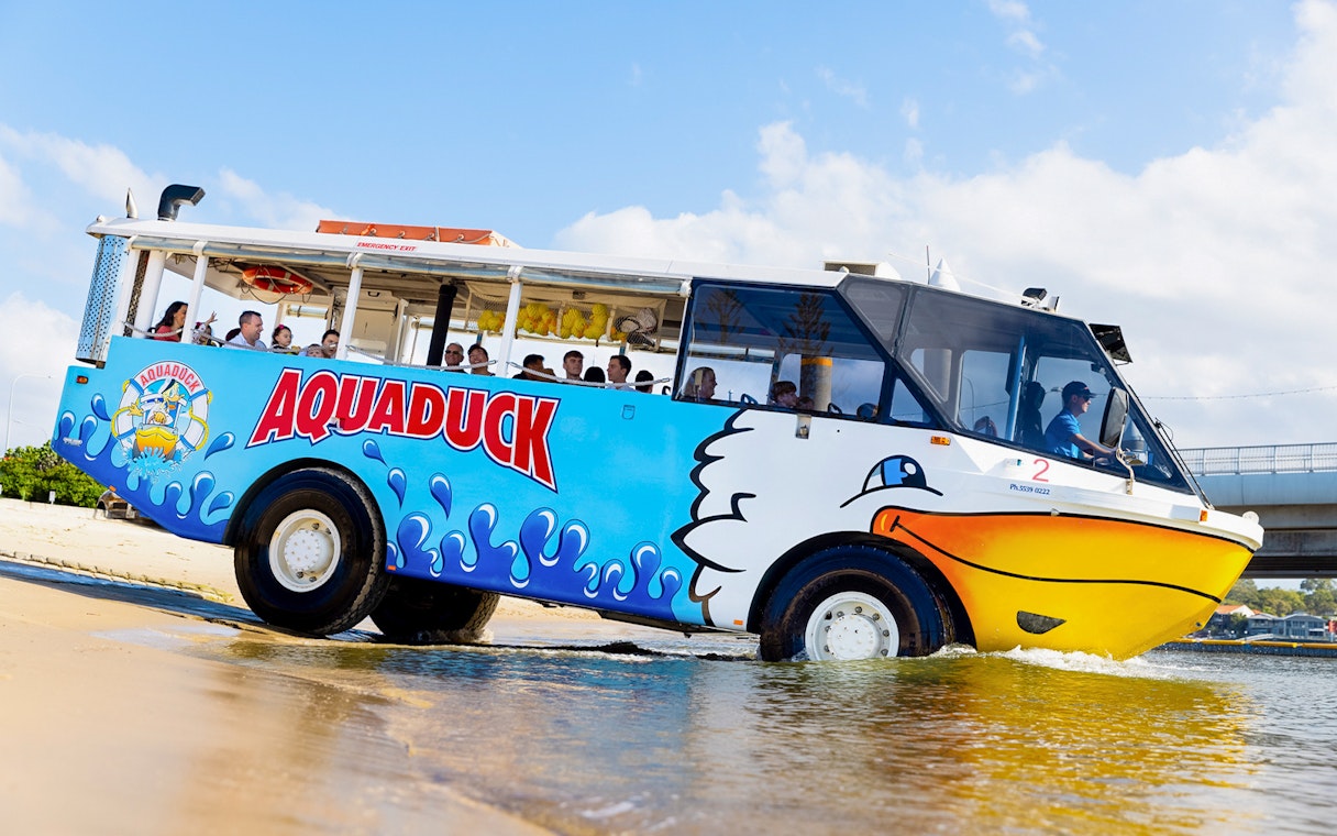 Aquaduck vehicle transitioning from land to water on a Gold Coast city tour.