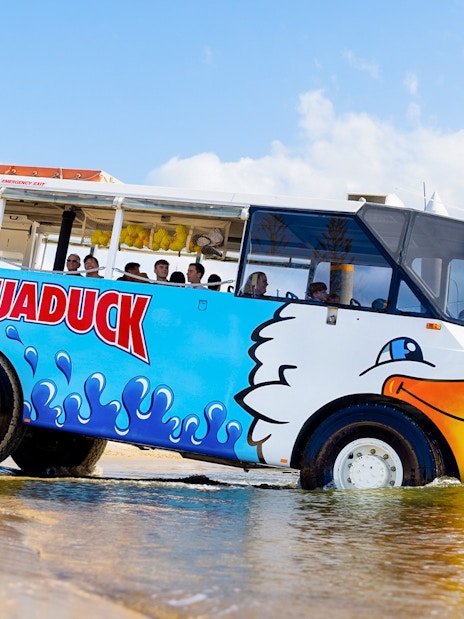 Aquaduck vehicle transitioning from land to water on a Gold Coast city tour.