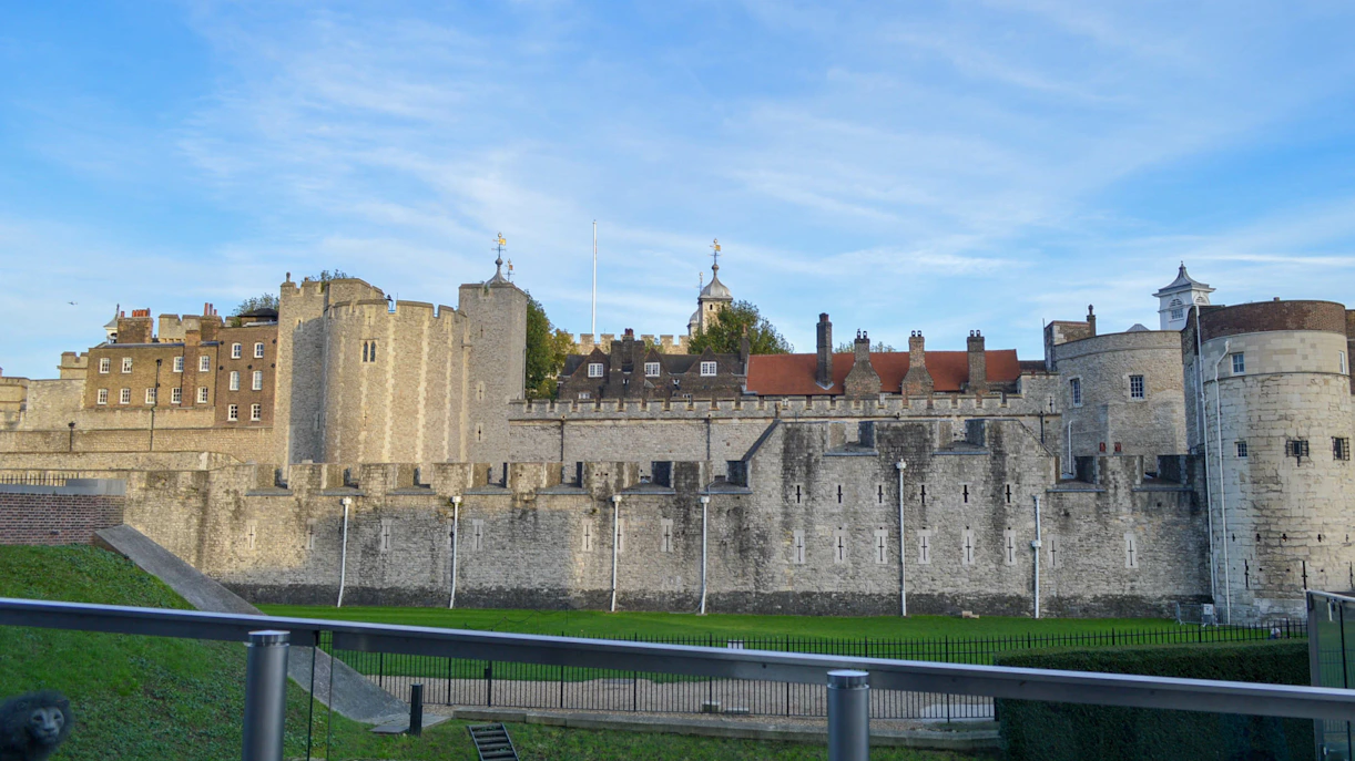 Beauchamp Tower at the Tower of London with historic stone walls and blue sky.