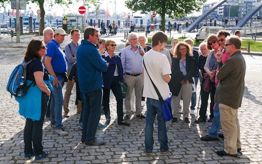 Group on Elbphilharmonie Plaza guided tour in Hamburg, near harbor.