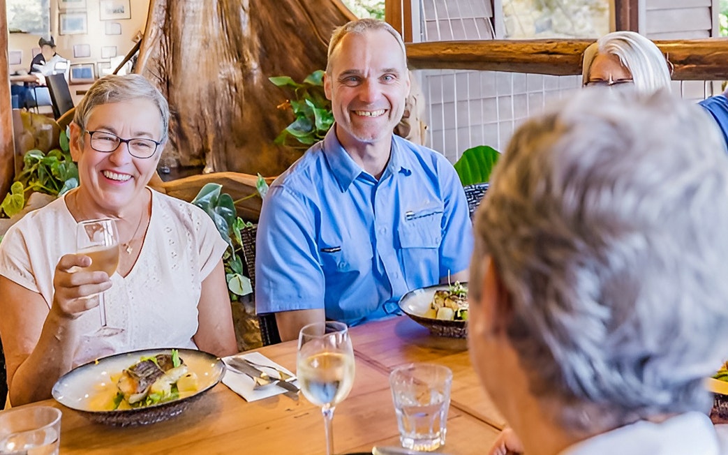 Group enjoying lunch and wine tasting on Sunshine Coast Hinterland tour.