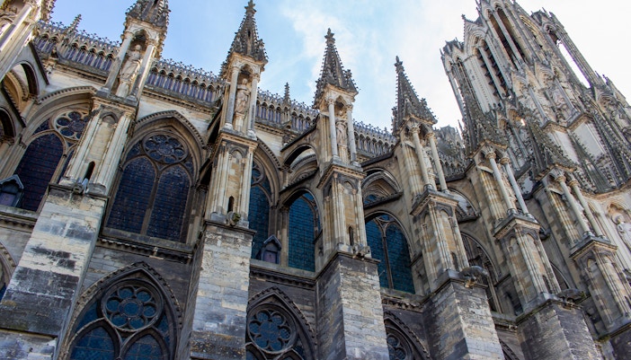 Notre Dame de Reims, France, showcasing Gothic architecture and flying buttresses.