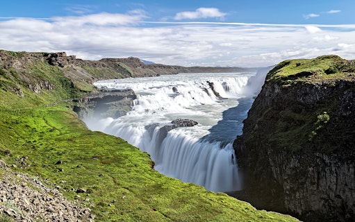 Gullfoss waterfall cascading over rocky cliffs in Iceland.
