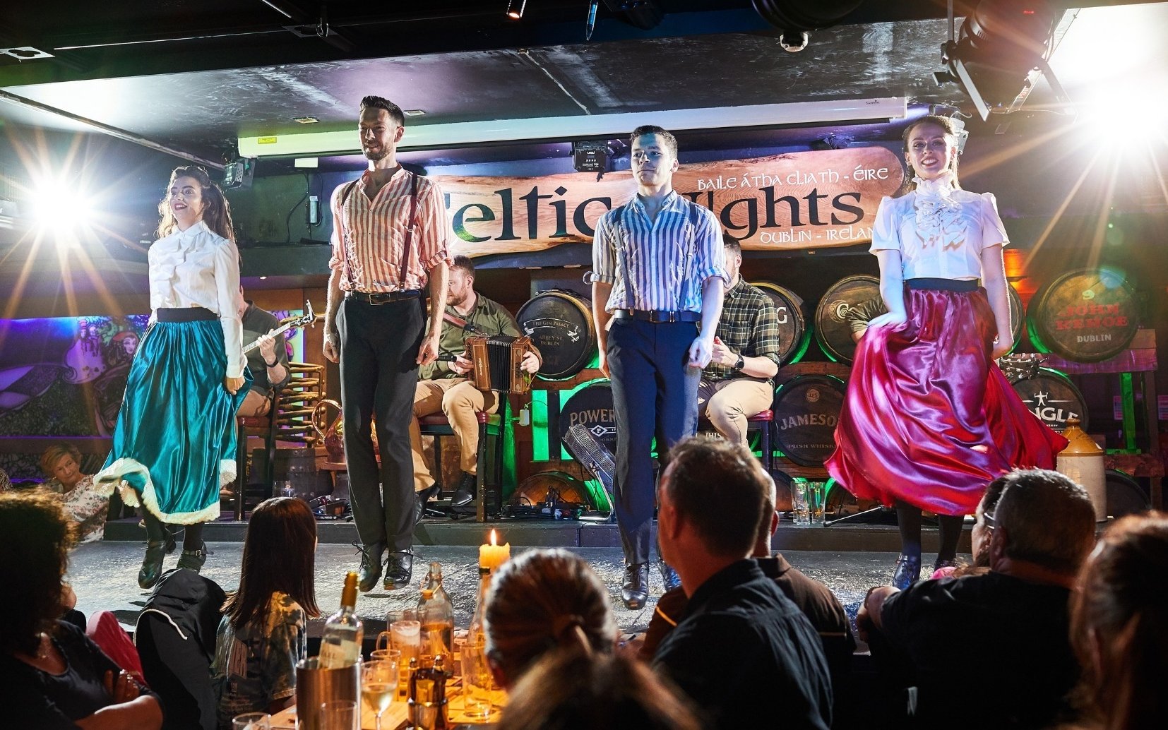 Dancers performing traditional Irish dance at Celtic Nights show in Dublin.