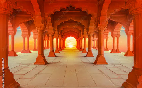 Arched corridor at Red Fort, Delhi, with sunset view on guided tour.