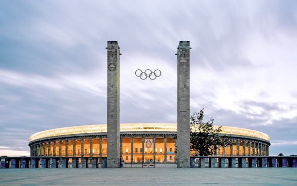 Olympiastadion Berlin exterior with iconic columns and arches, showcasing historic architecture in Germany.