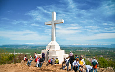 Pilgrims gathered at the summit of Križevac hill, Medjugorje, Bosnia and Herzegovina.