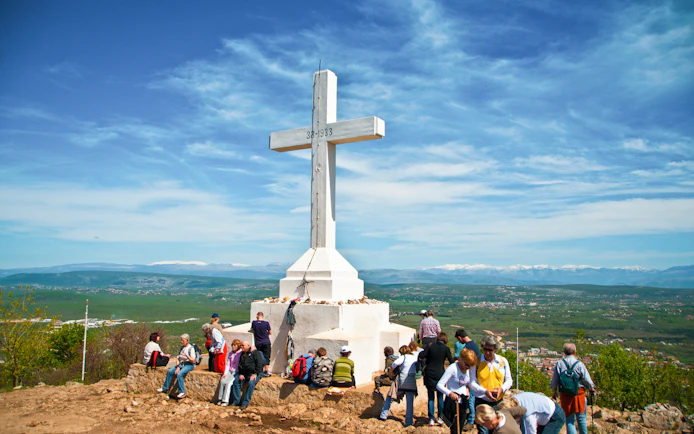 Pilgrims gathered at the summit of Križevac hill, Medjugorje, Bosnia and Herzegovina.