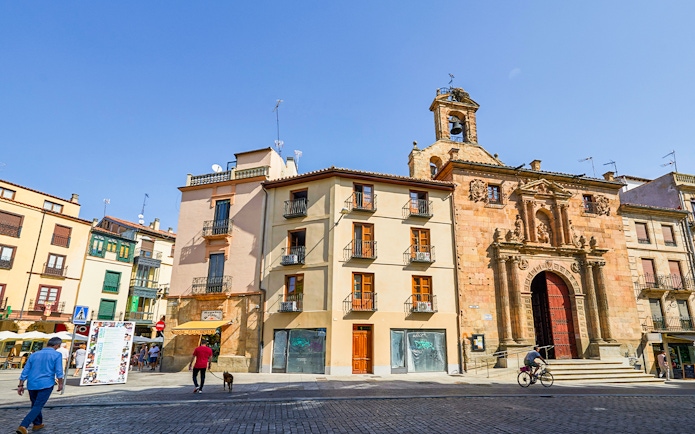 Historic buildings and church facade at Plaza del Corrillo, Salamanca City, Spain.