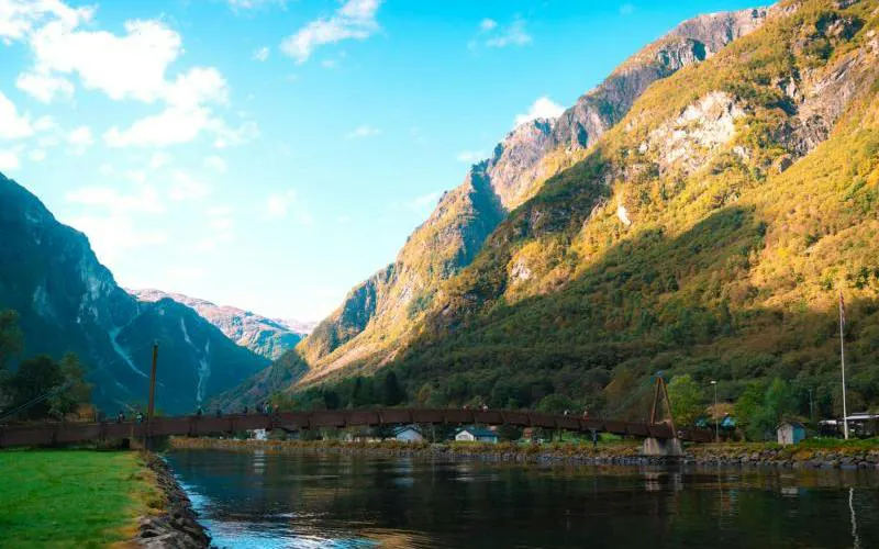 Bergen to Flåm railway view with mountains and river, part of Nærøyfjord UNESCO cruise tour.