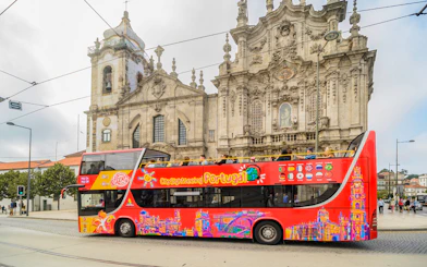 HOHO tour bus in front of Igreja do Carmo, Porto, Portugal.