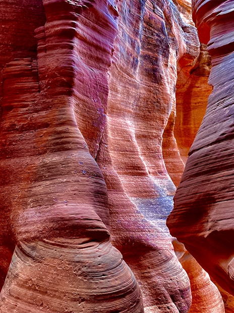 Antelope Canyon X sandstone formations with vibrant colors and light patterns.