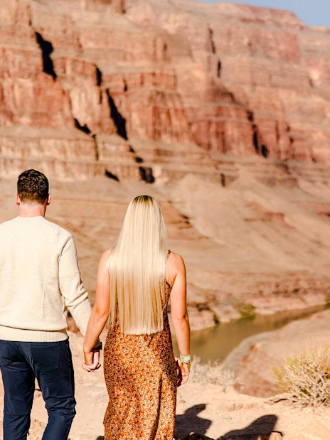 Guests walking at Grand Canyon West Rim during helicopter tour floor landing.