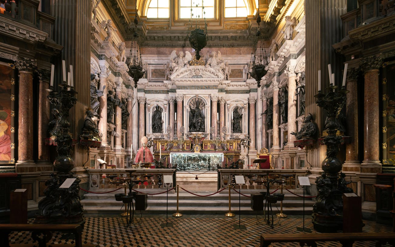 Royal Chapel of the Treasure of San Gennaro interior with ornate altar and sculptures.