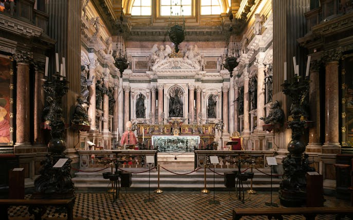 Royal Chapel of the Treasure of San Gennaro interior with ornate altar and sculptures.