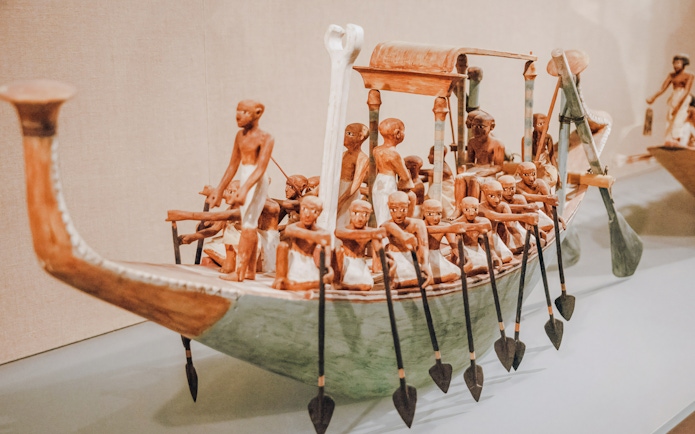 Ancient Egyptian boat model with 14 oarsmen and canopy at the Metropolitan Museum of Art.