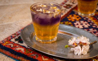 Traditional Moroccan tea on a silver tray with flowers, Marrakesh.