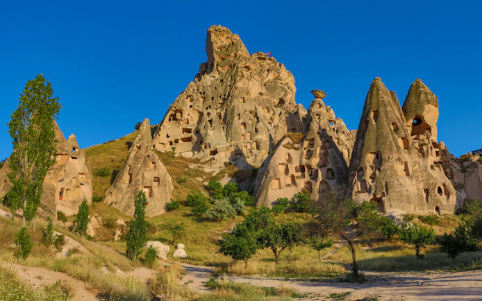 Uçhisar Castle with surrounding fairy chimneys in Cappadocia, Turkey.