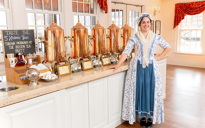 Tea tasting setup at Boston Tea Party Museum with staff in period costume.