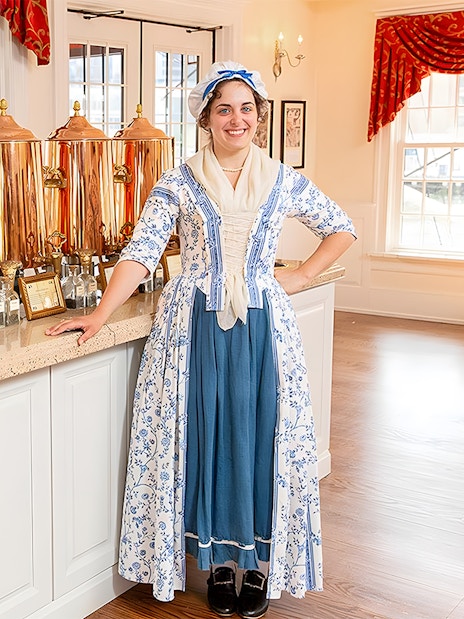 Tea tasting setup at Boston Tea Party Museum with staff in period costume.