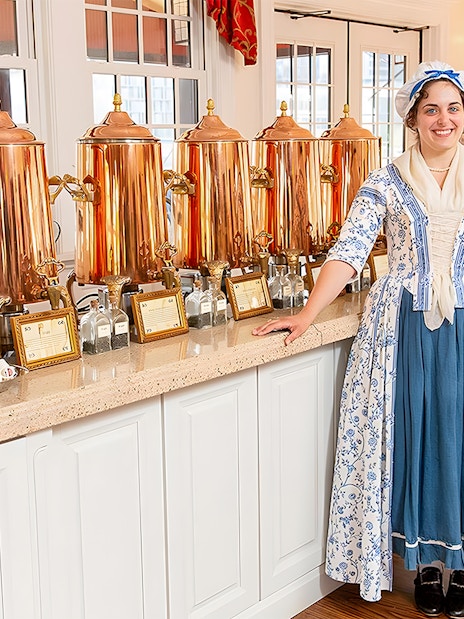 Tea tasting setup at Boston Tea Party Museum with staff in period costume.
