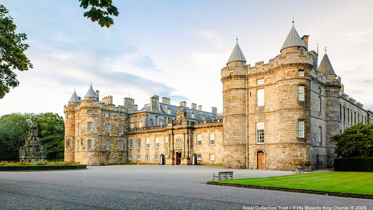 Palace of Holyroodhouse exterior with stone towers and courtyard in Edinburgh, Scotland.