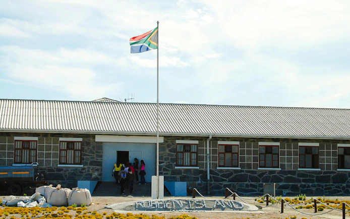 Robben Island prison entrance with South African flag.