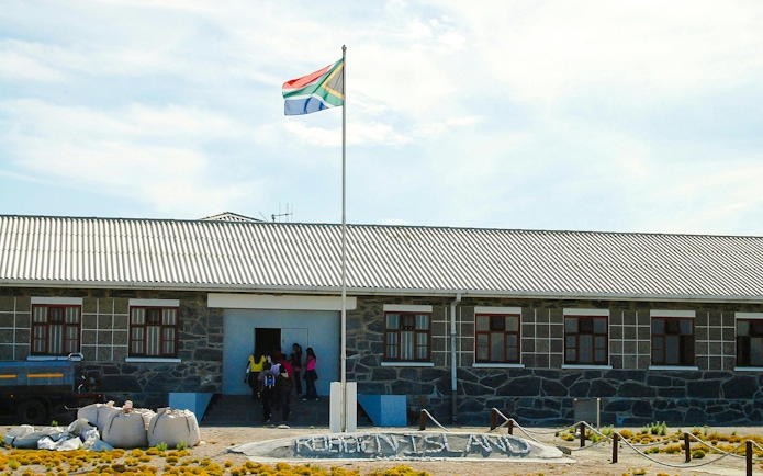 Robben Island prison entrance with South African flag.