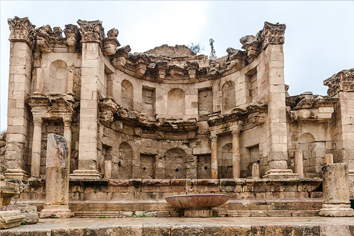 Roman ruins in Jerash, featuring ancient stone columns and arches, part of a day trip from Amman.