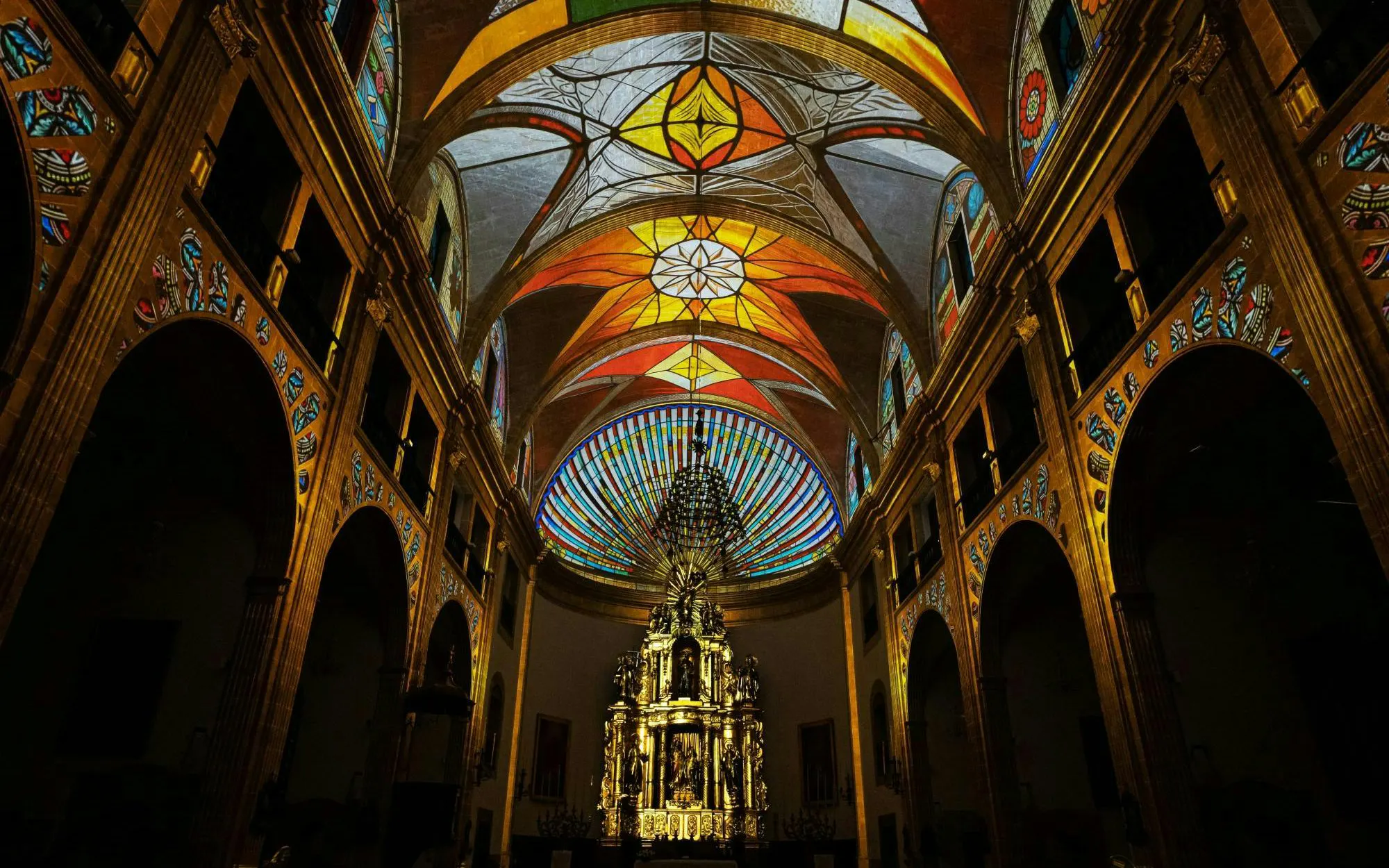 Elements show with stained glass ceiling inside Església dels Sagrats Cors, Palma de Mallorca.