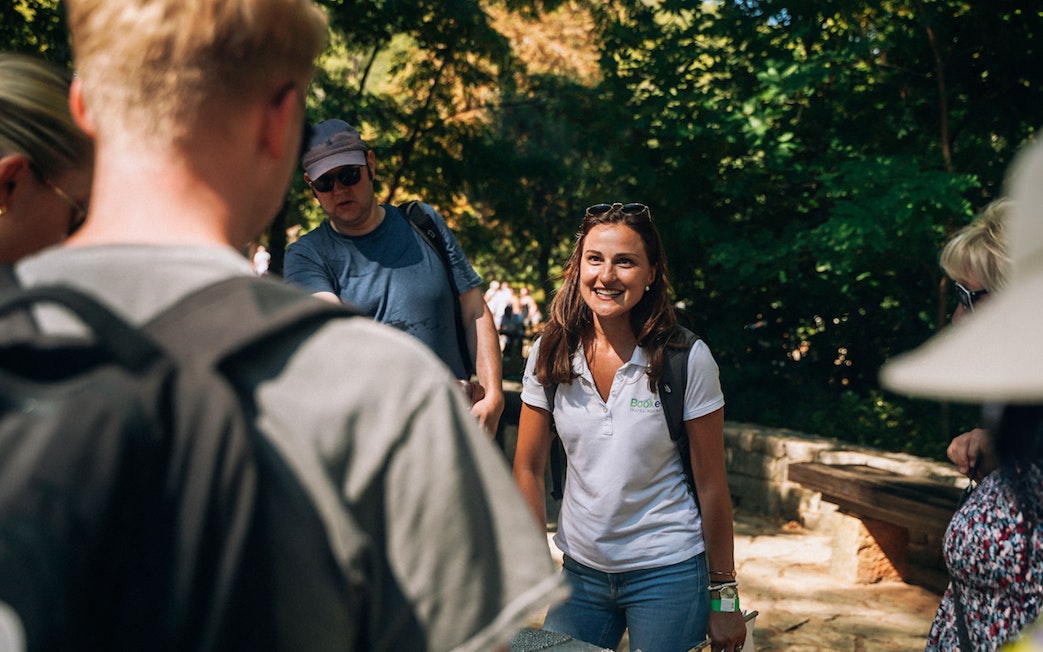 Tour guide leading a group at Krka Waterfalls, Split.