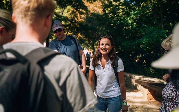 Tour guide leading a group at Krka Waterfalls, Split.