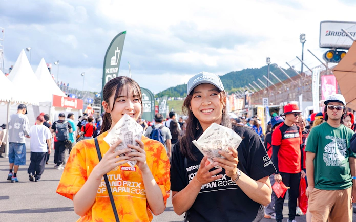 Tourists enjoying snacks at Motul Grand Prix of Japan 2026 event.