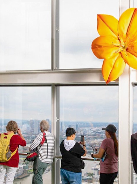 Visitors enjoying the London skyline from The Shard's observation deck.