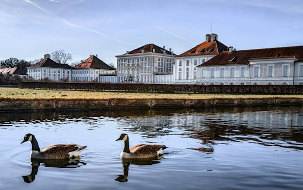 Nymphenburg Palace with geese swimming in the foreground, Munich, Germany.