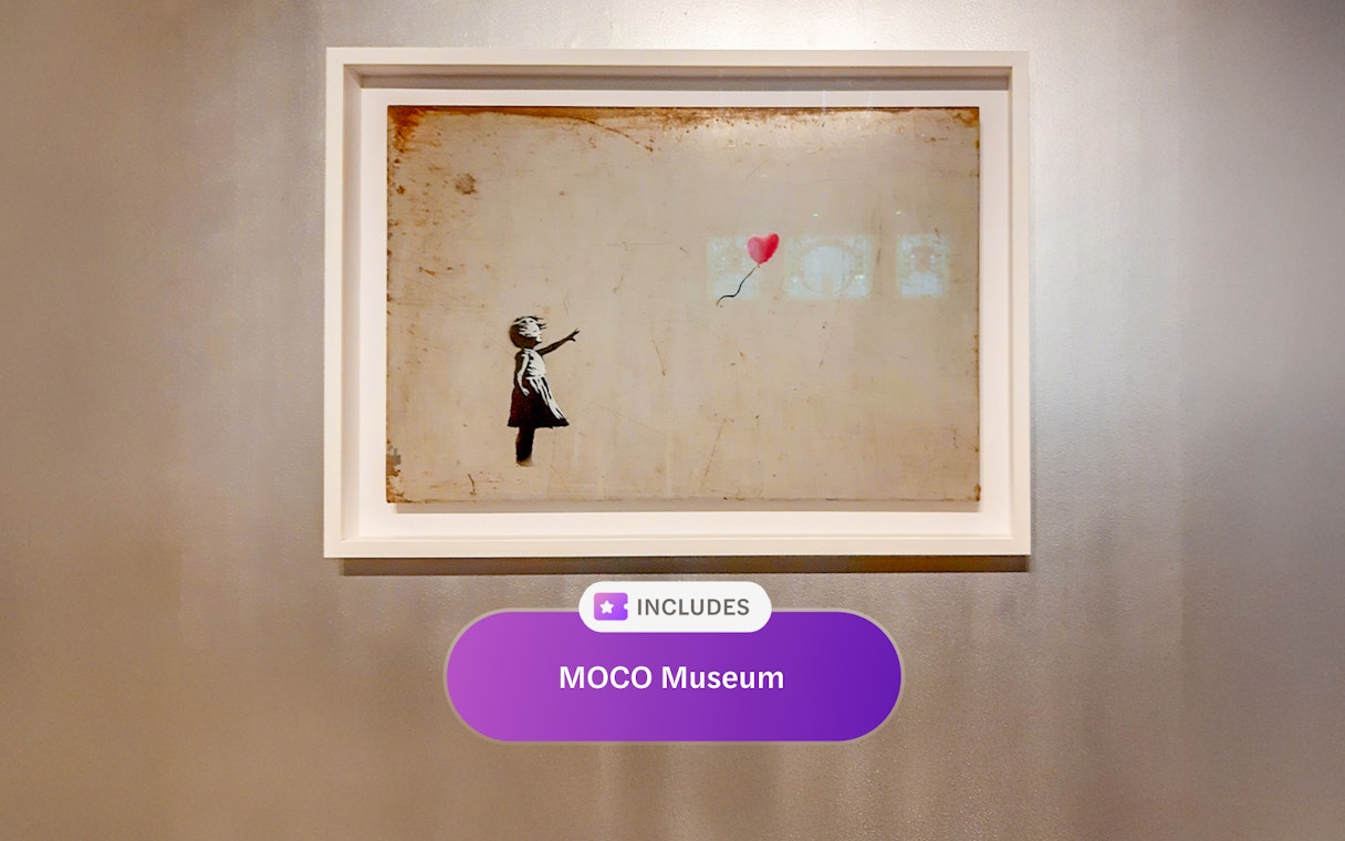 Artwork of a child with a balloon at MOCO Museum, Amsterdam.