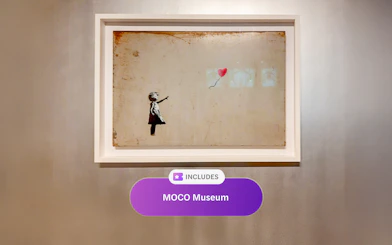 Artwork of a child with a balloon at MOCO Museum, Amsterdam.