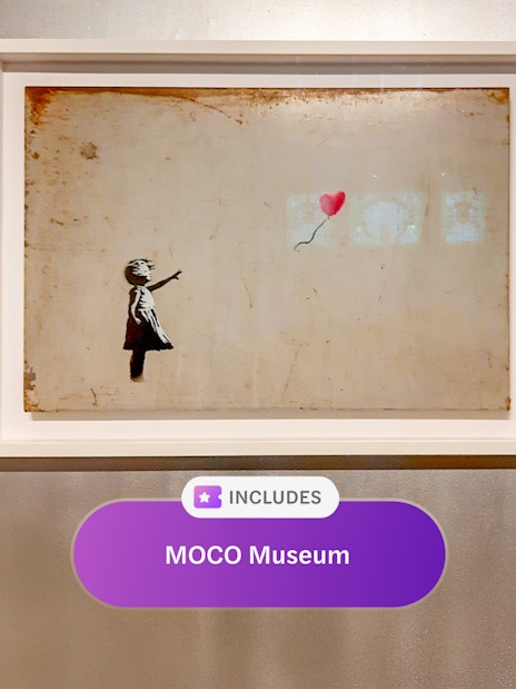 Artwork of a child with a balloon at MOCO Museum, Amsterdam.