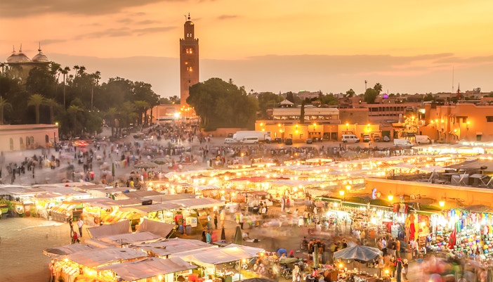 Jema el Fna square in Marrakesh bustling with night market activity.