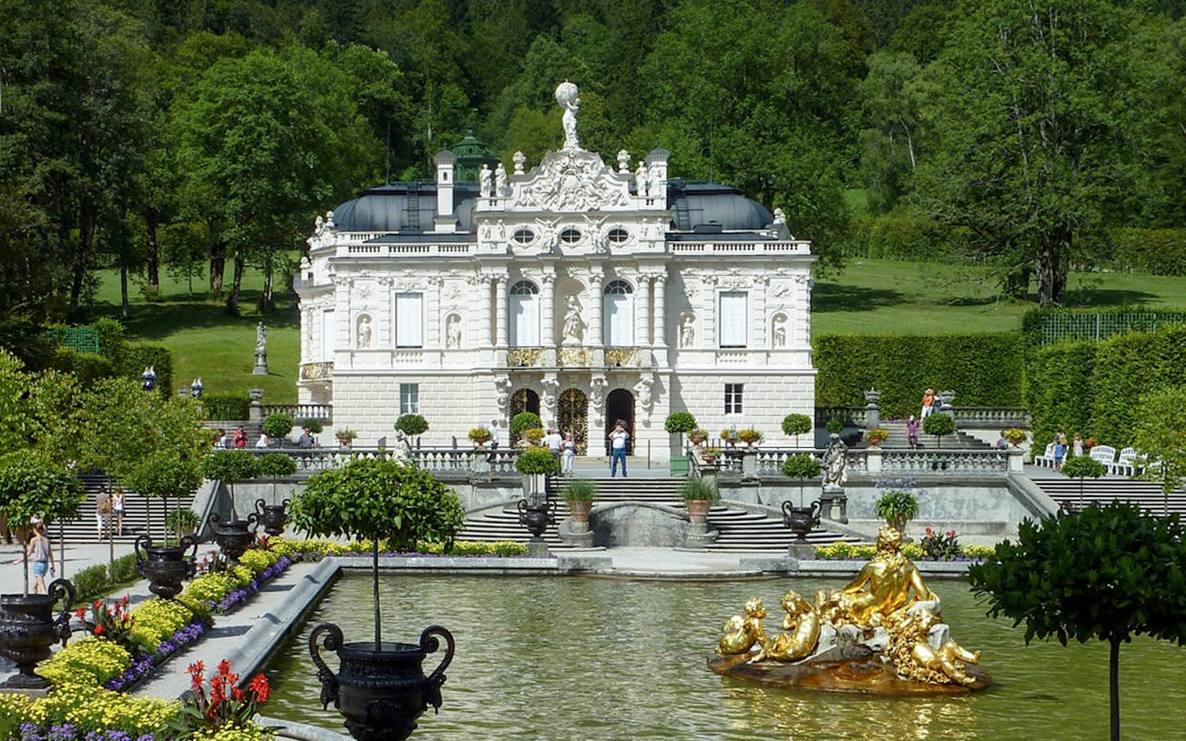Linderhof Palace with gardens and fountain, part of a day trip from Munich.