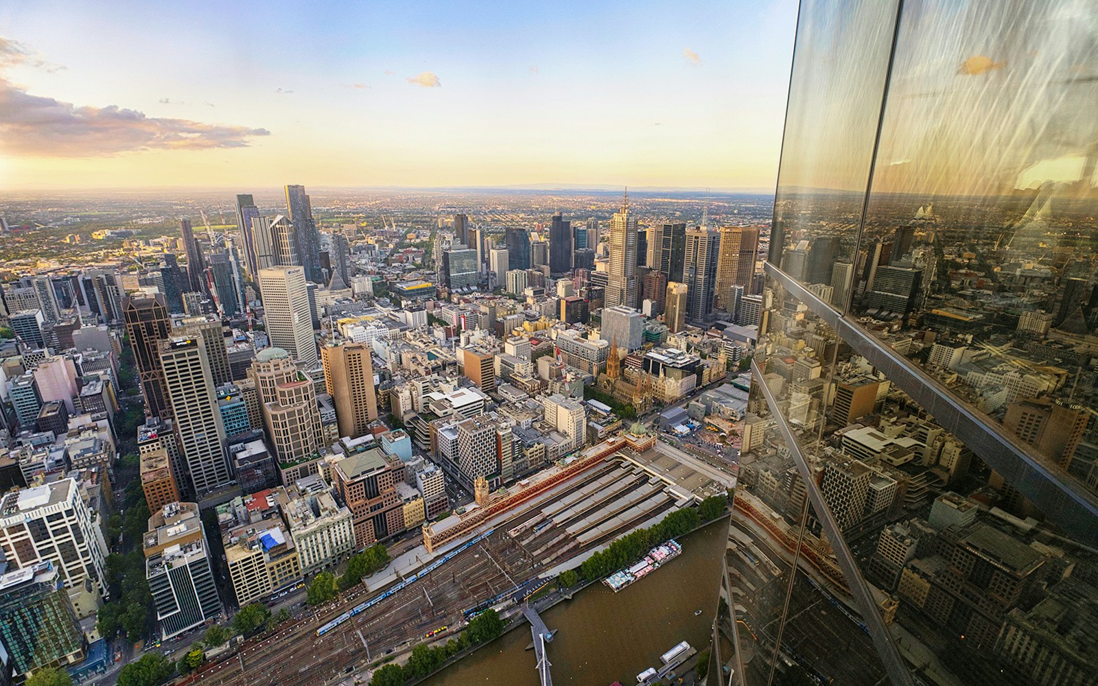 Aerial view of Melbourne cityscape from the Skydeck with reflections on glass.