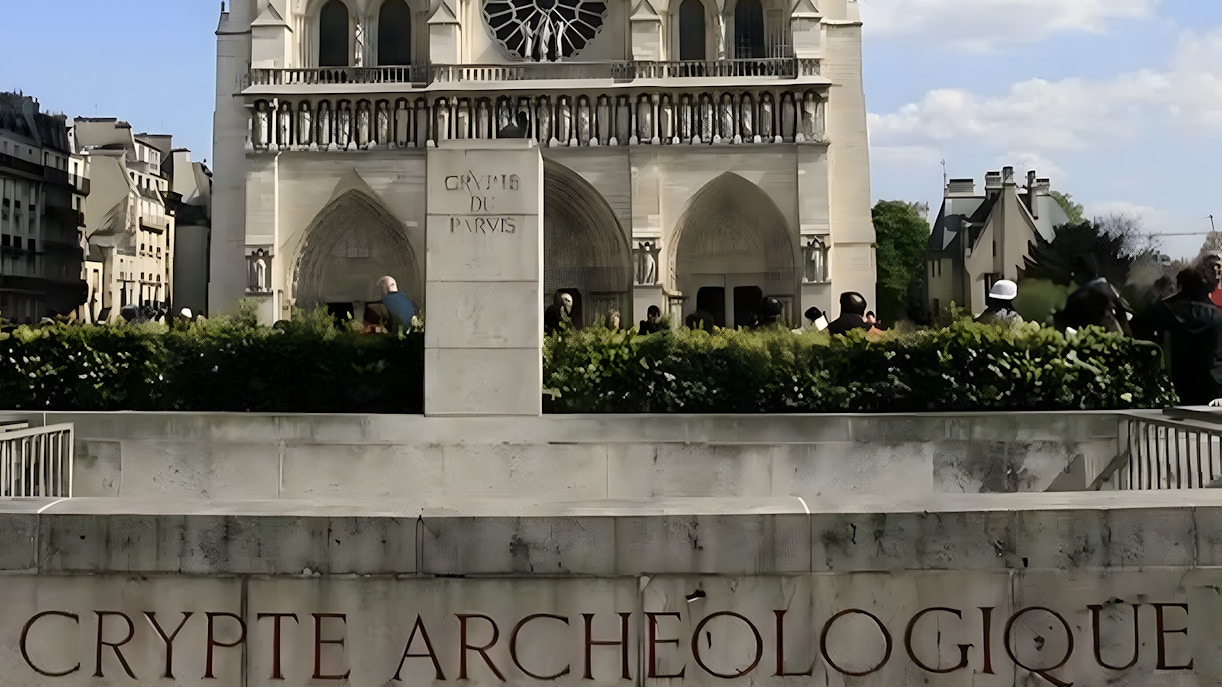 Crypte Archéologique entrance with Notre-Dame Cathedral in the background, Paris.