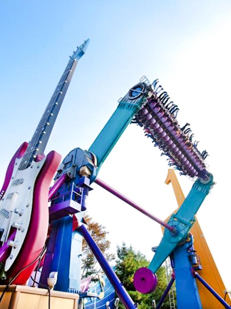 Everland Theme Park ride with giant guitar and rotating seats.
