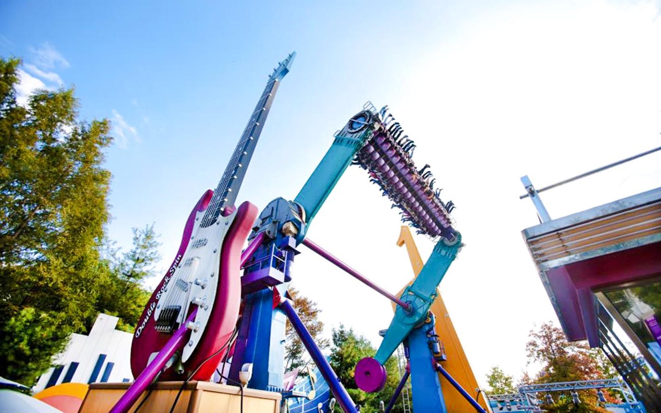 Everland Theme Park ride with giant guitar and rotating seats.